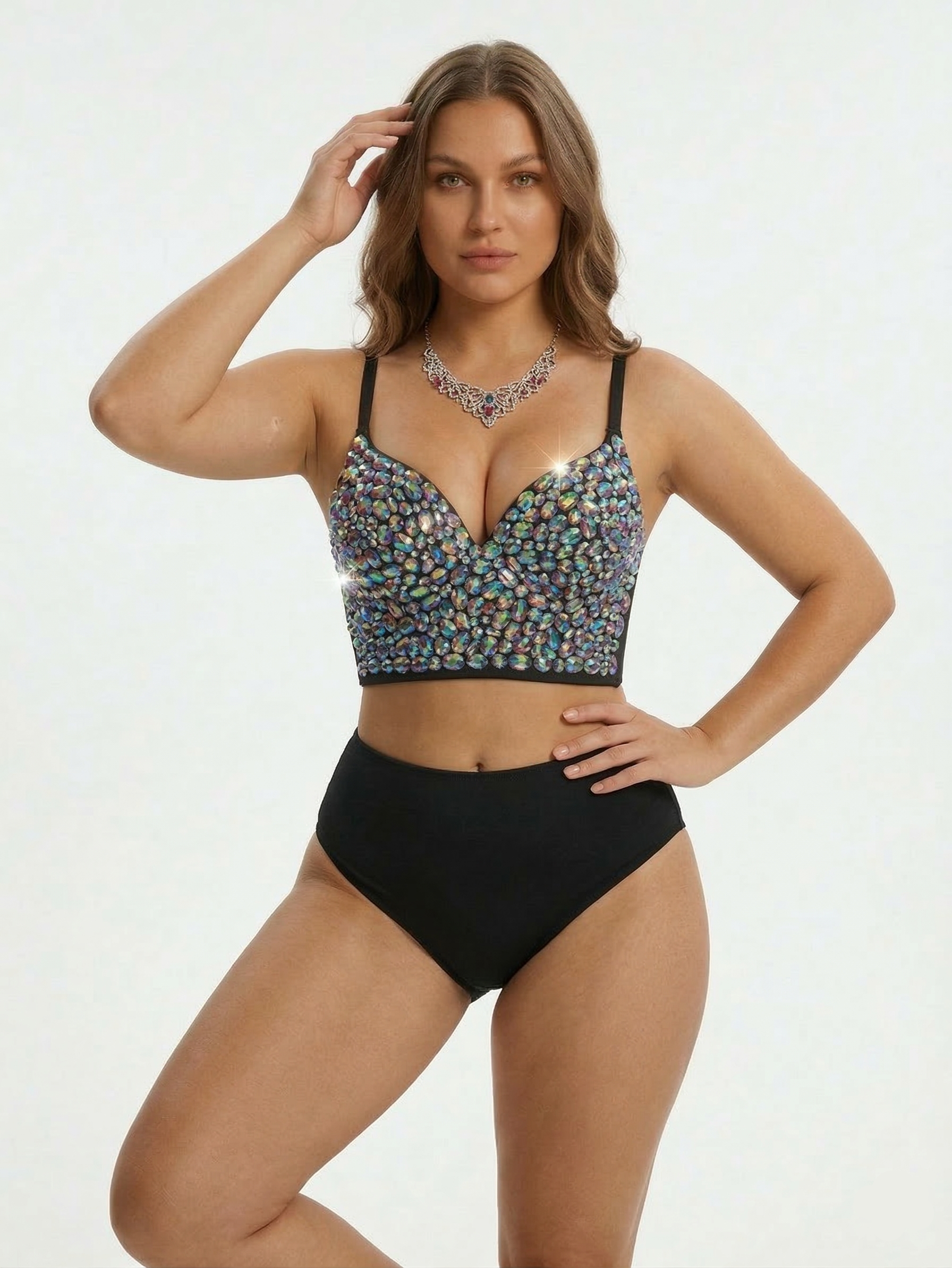 Woman wearing a black bikini with a colorful top on a white background